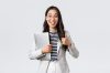 Business, finance and employment, female successful entrepreneurs concept. Young confident businesswoman in glasses, showing thumbs-up gesture, hold laptop, guarantee best service quality Business, finance and employment, female successful entrepreneurs concept. Young confident businesswoman in glasses, showing thumbs-up gesture, hold laptop, guarantee best service quality.